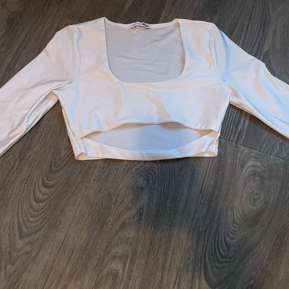 Never worn before. Not recommended for those with a larger bust.